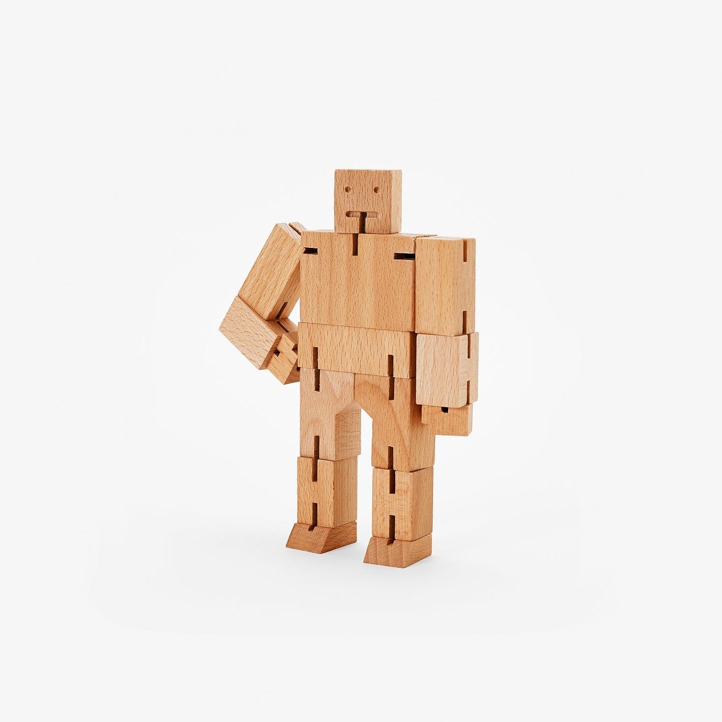 Wooden Cubebot toy posed like a robot, inspired by Japanese Shinto Kumi-ki puzzles.