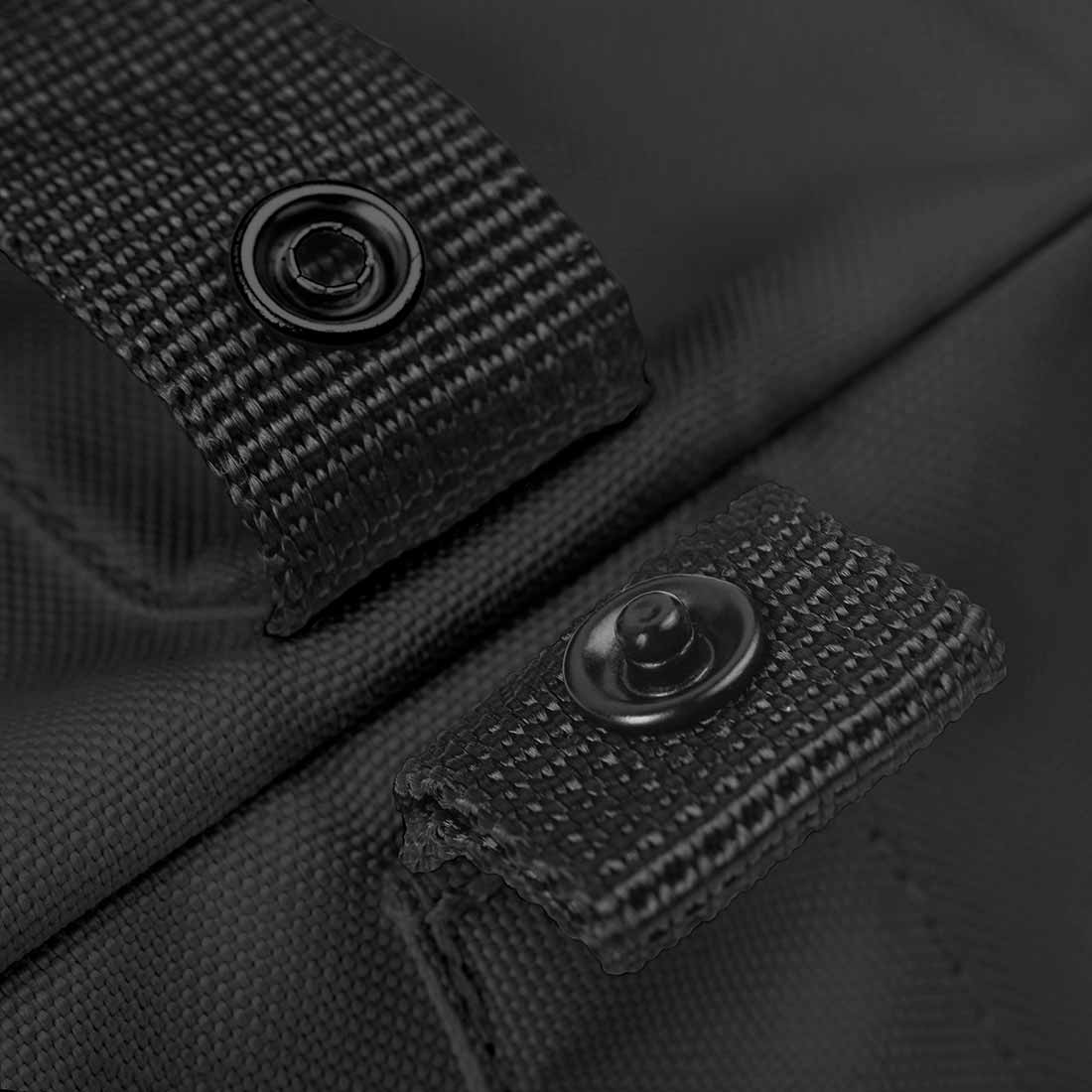 Notabag crossbody unfolded to full size, showing inner pockets and snap hook for keys