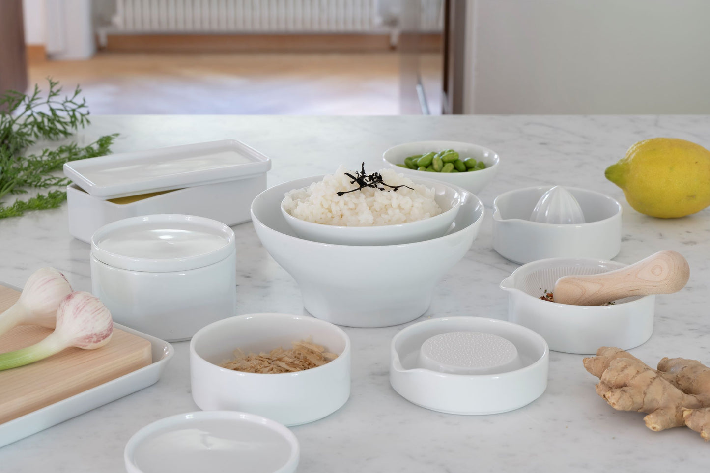 Porcelain storage container from Sitaku—stackable and part of a modular collection of minimal kitchen essentials.