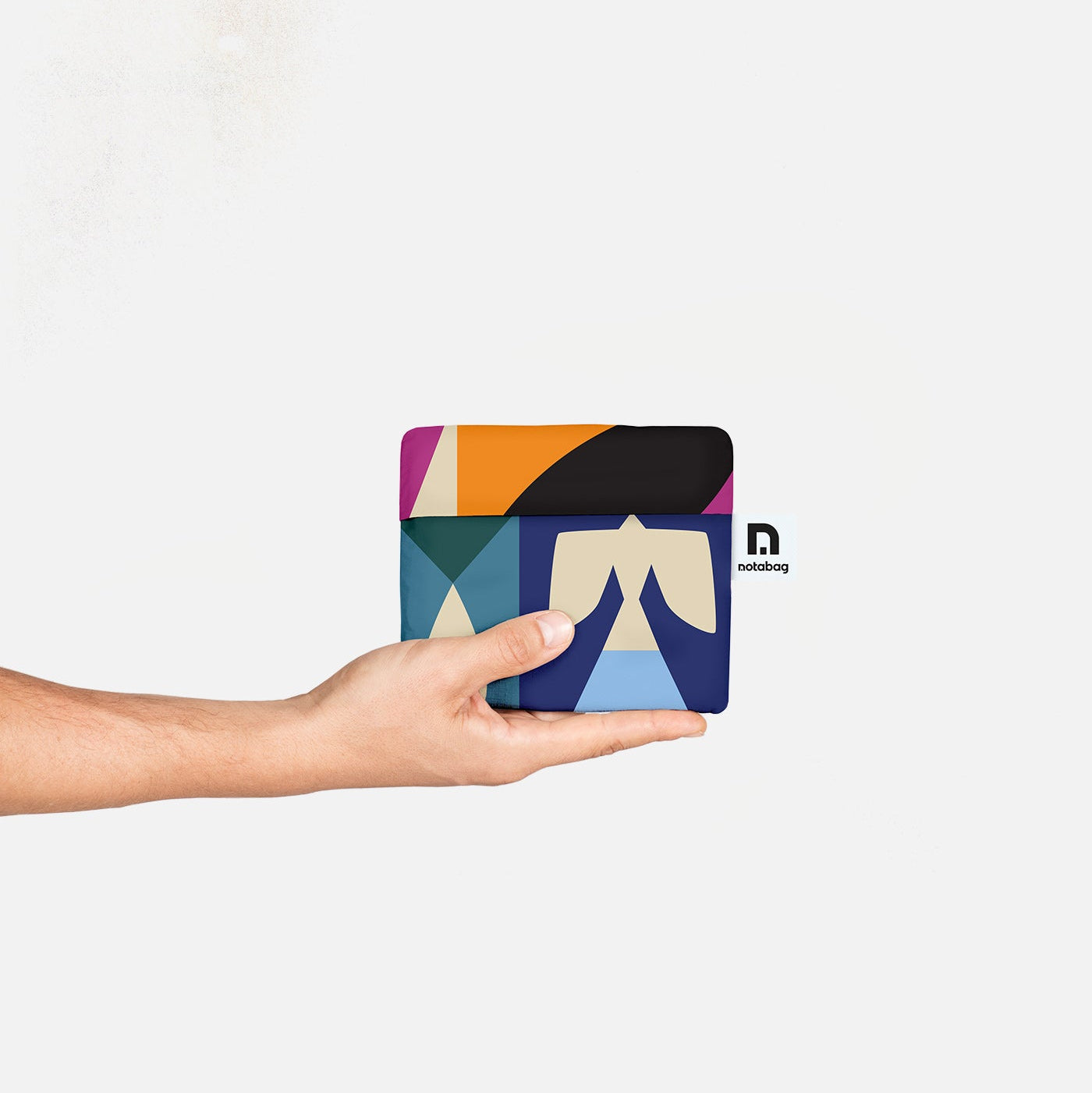 A smart combination of a bag and a backpack, foldable, lightweight and sturdy. Colourful design by Barcelona artist Judit Canela for notabag.