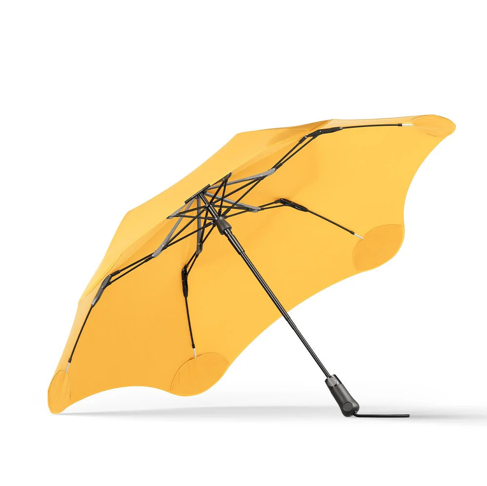 Foldable, compact umbrella that provides unparalleled protection against heavy rain and gusts of wind - stylish, reliable and built to last - metro citrus yellow