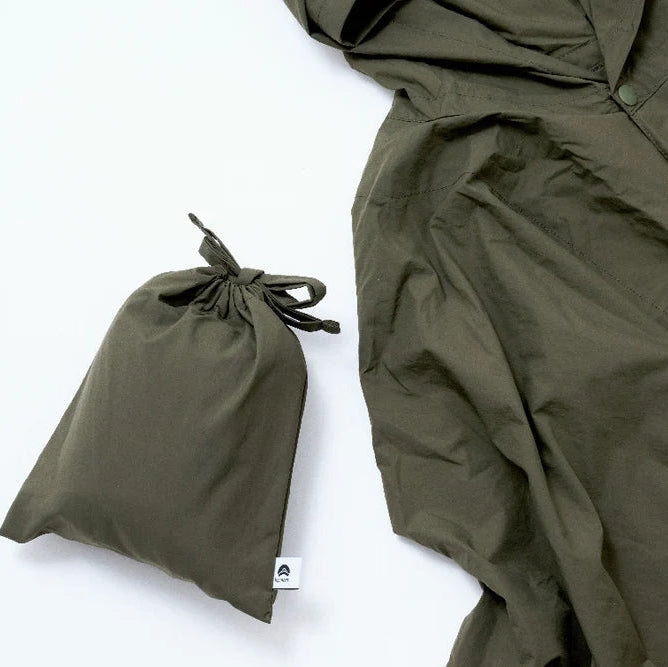 Foldable, lightweight rain poncho. Japanese textile innovation meets high functionality and timeless fashion design.