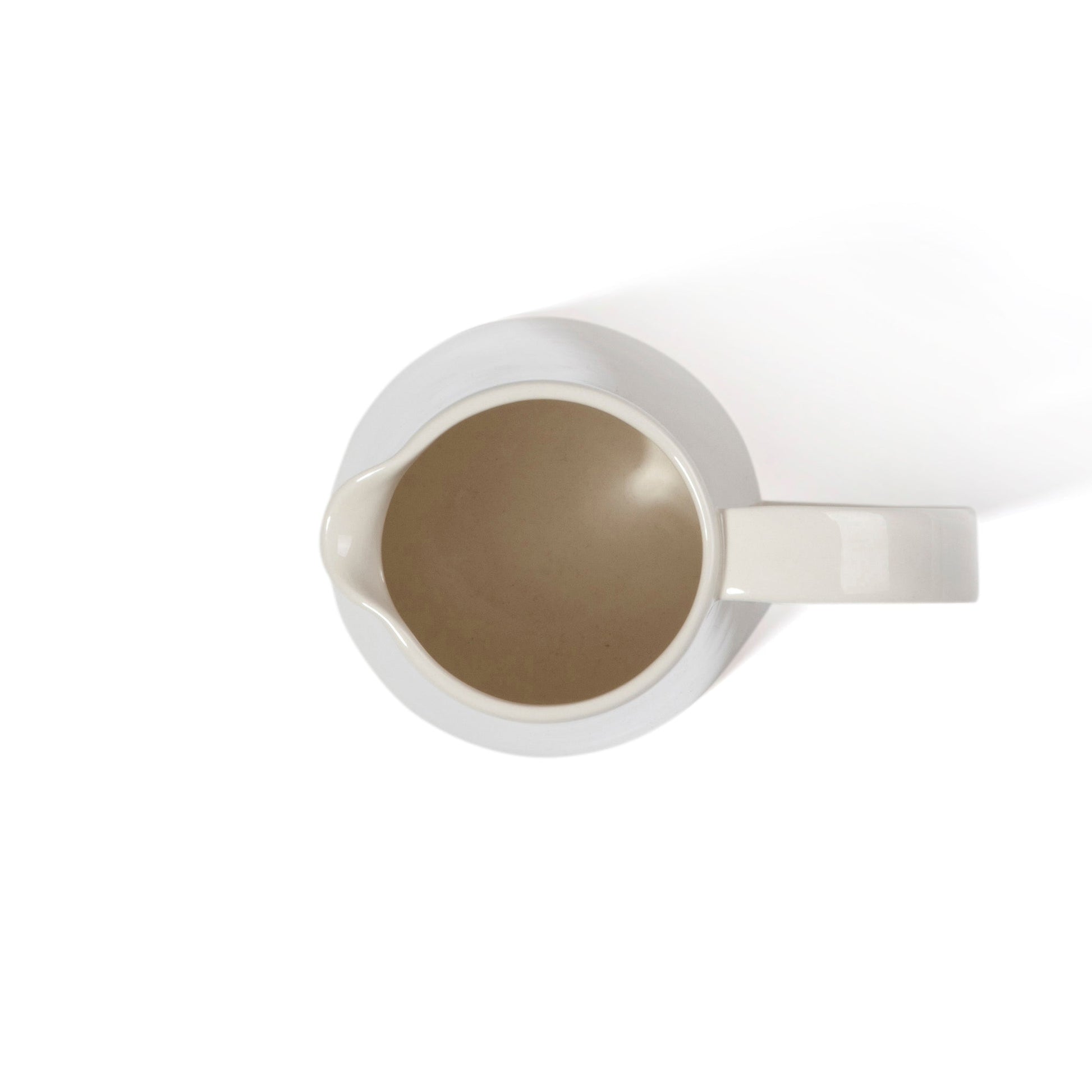 stoneware pitcher by another country - cream